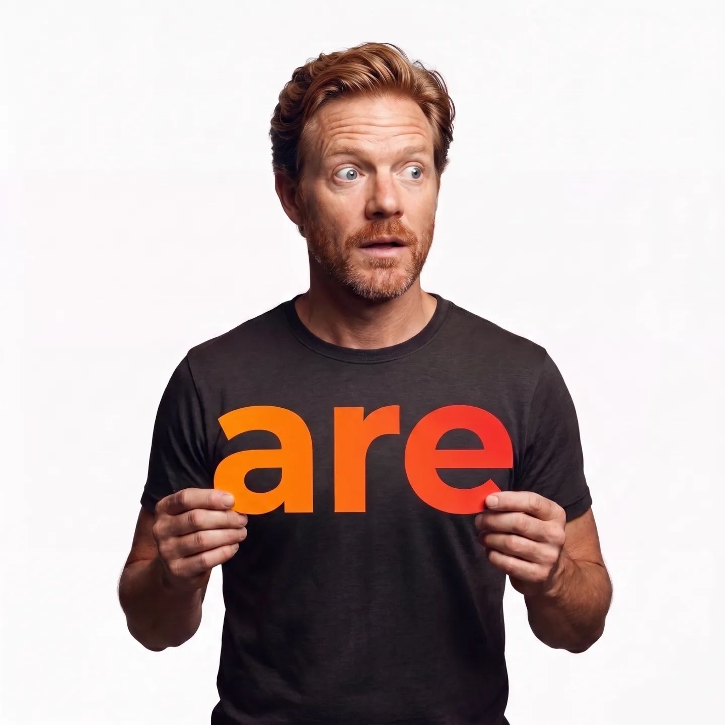 The founder holding a card that reads "are"
