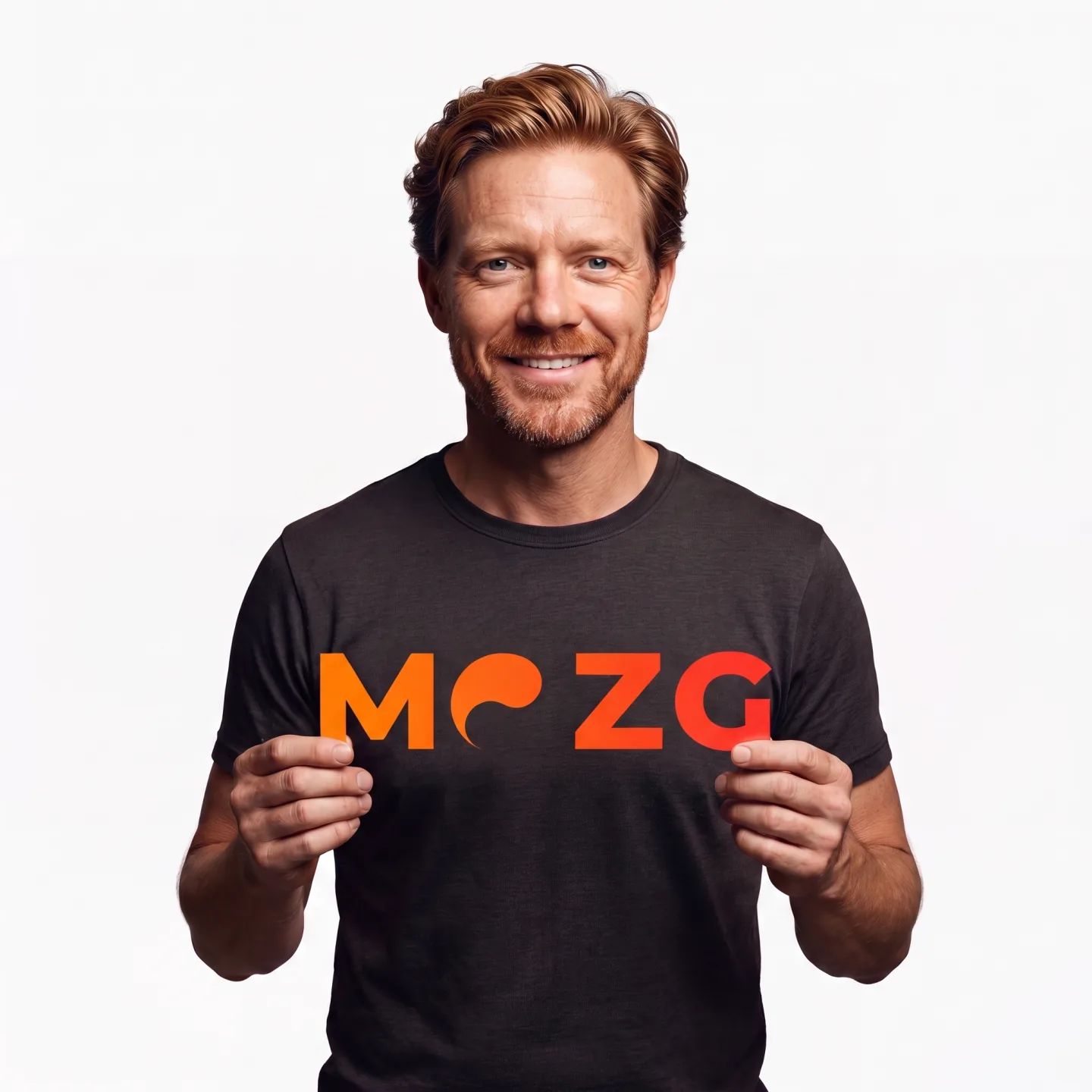 The founder holding a card showing the MOZG wordmark