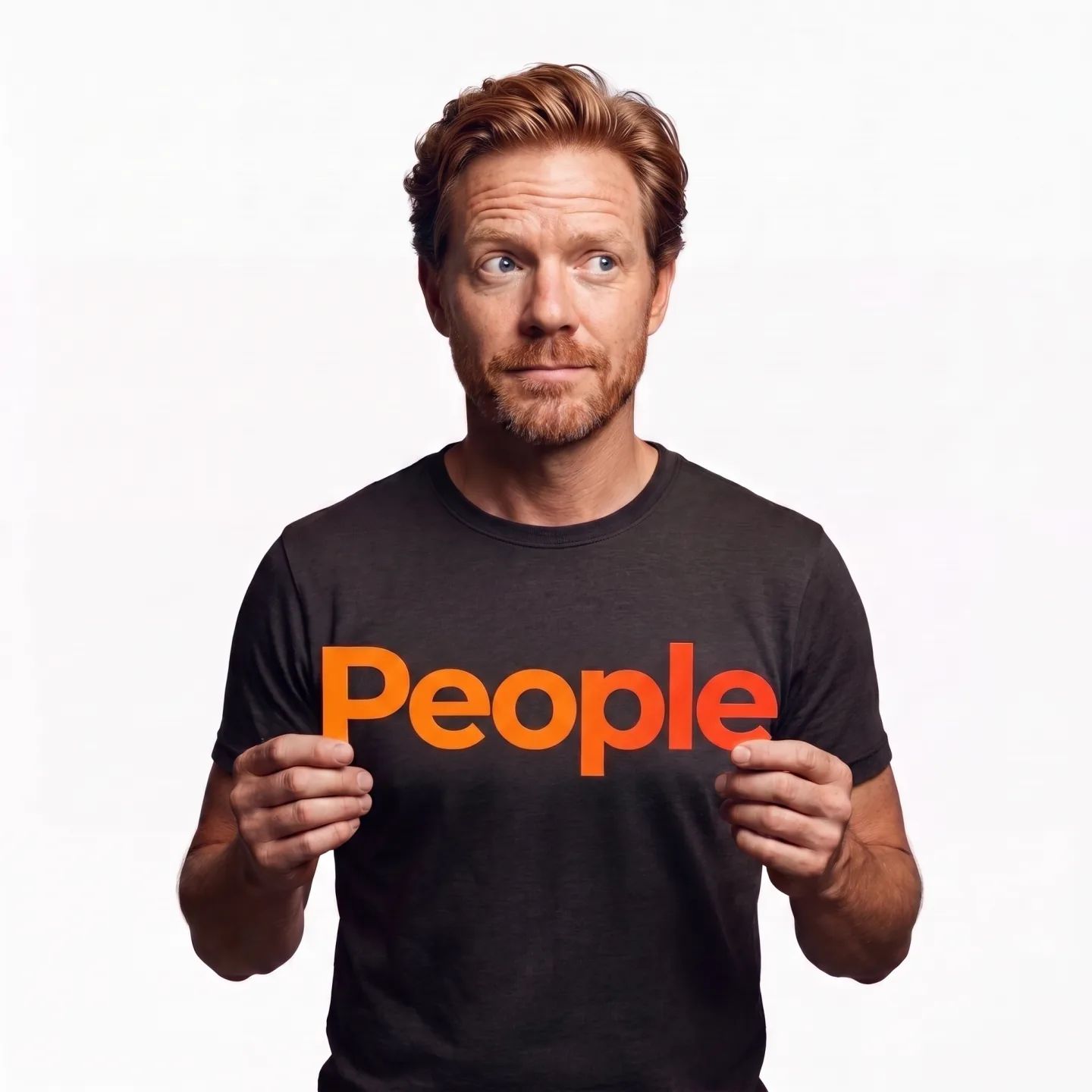 The founder holding a card that reads "People"